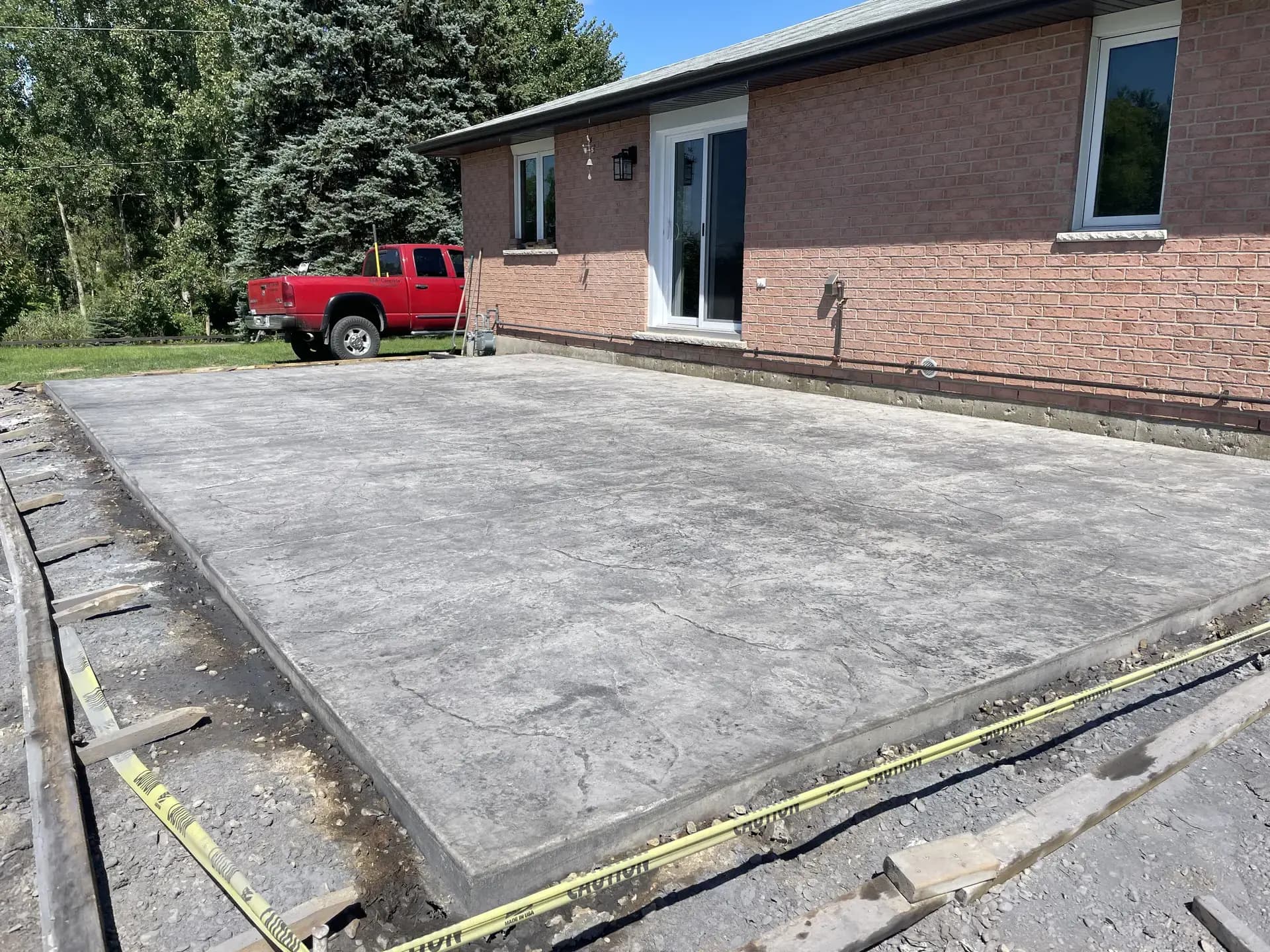 Backyard concrete driveway angle 2