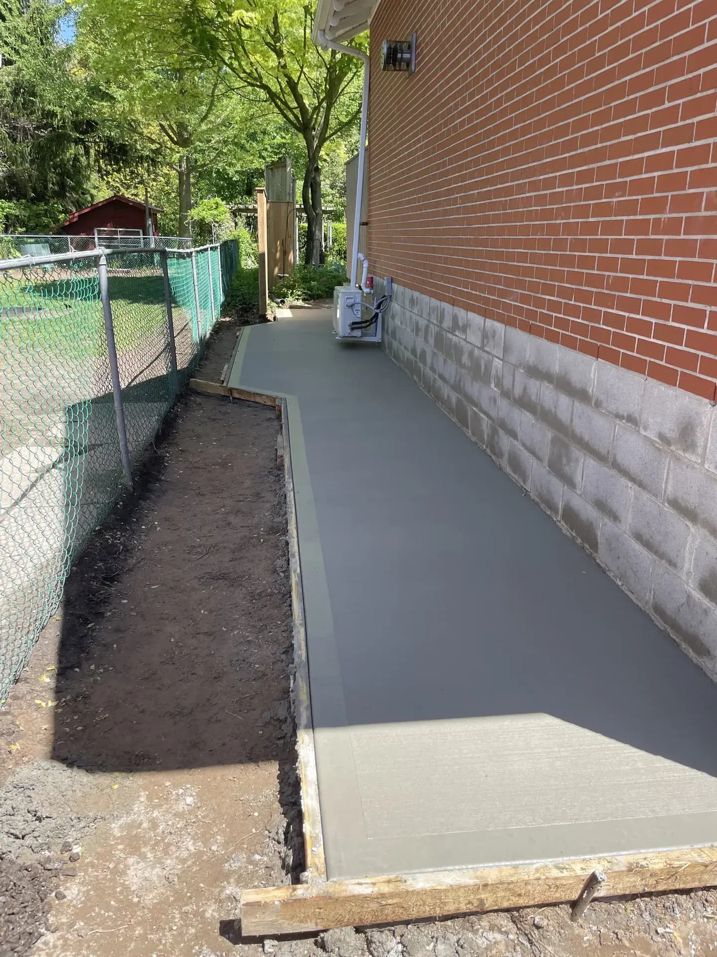 Foundation parging on brick house