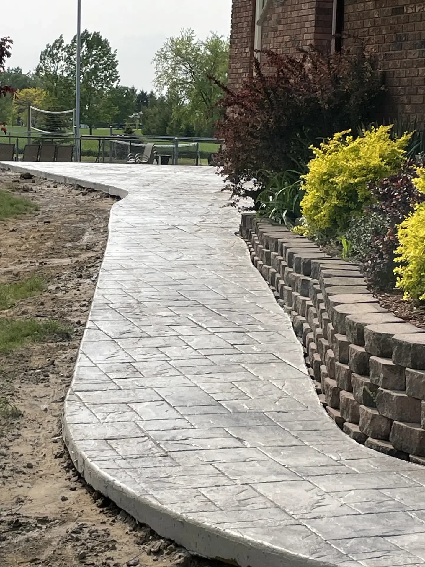 Curved stamped concrete driveway
