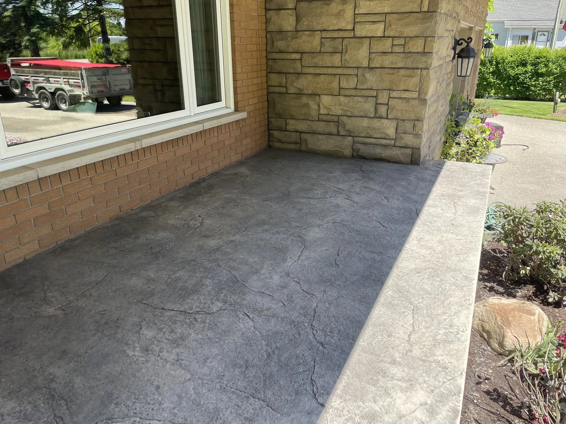 Stamped porch on stone house